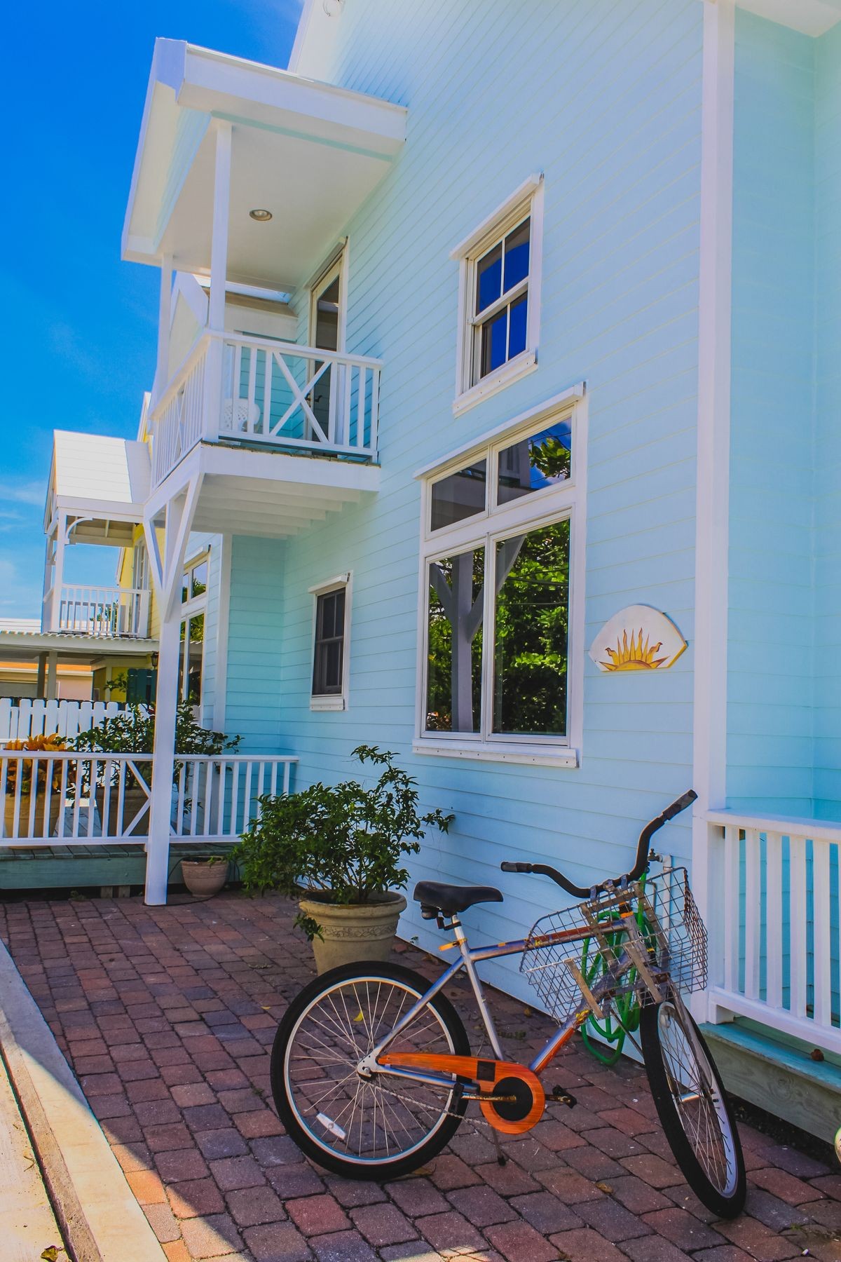 Colorful Caribbean Architecture, Caribbean house exterior with tropical plants and a bicycle. Elbow Cay, Hope Town, Abaco, The Bahama.